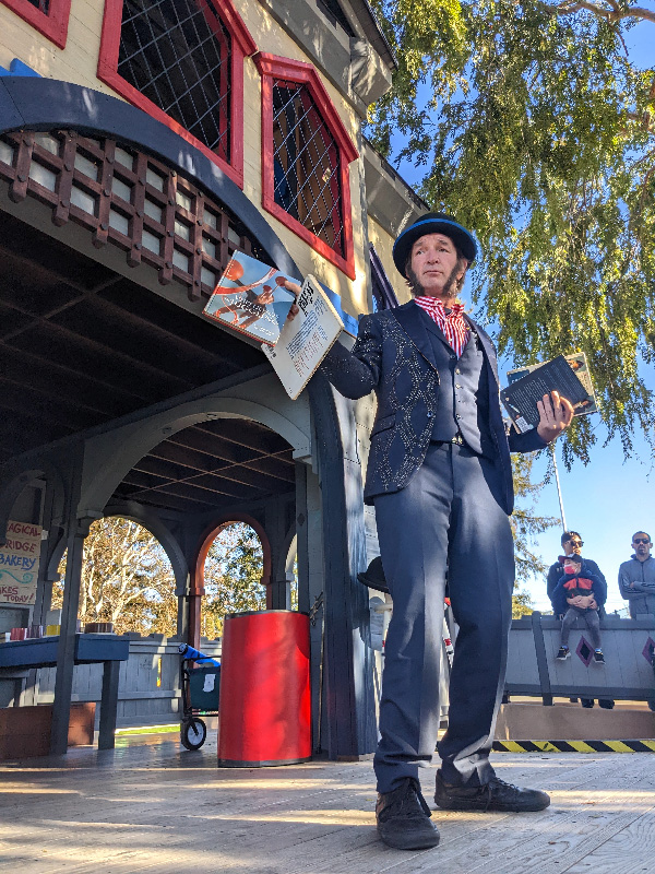 Slim holding various circus related books